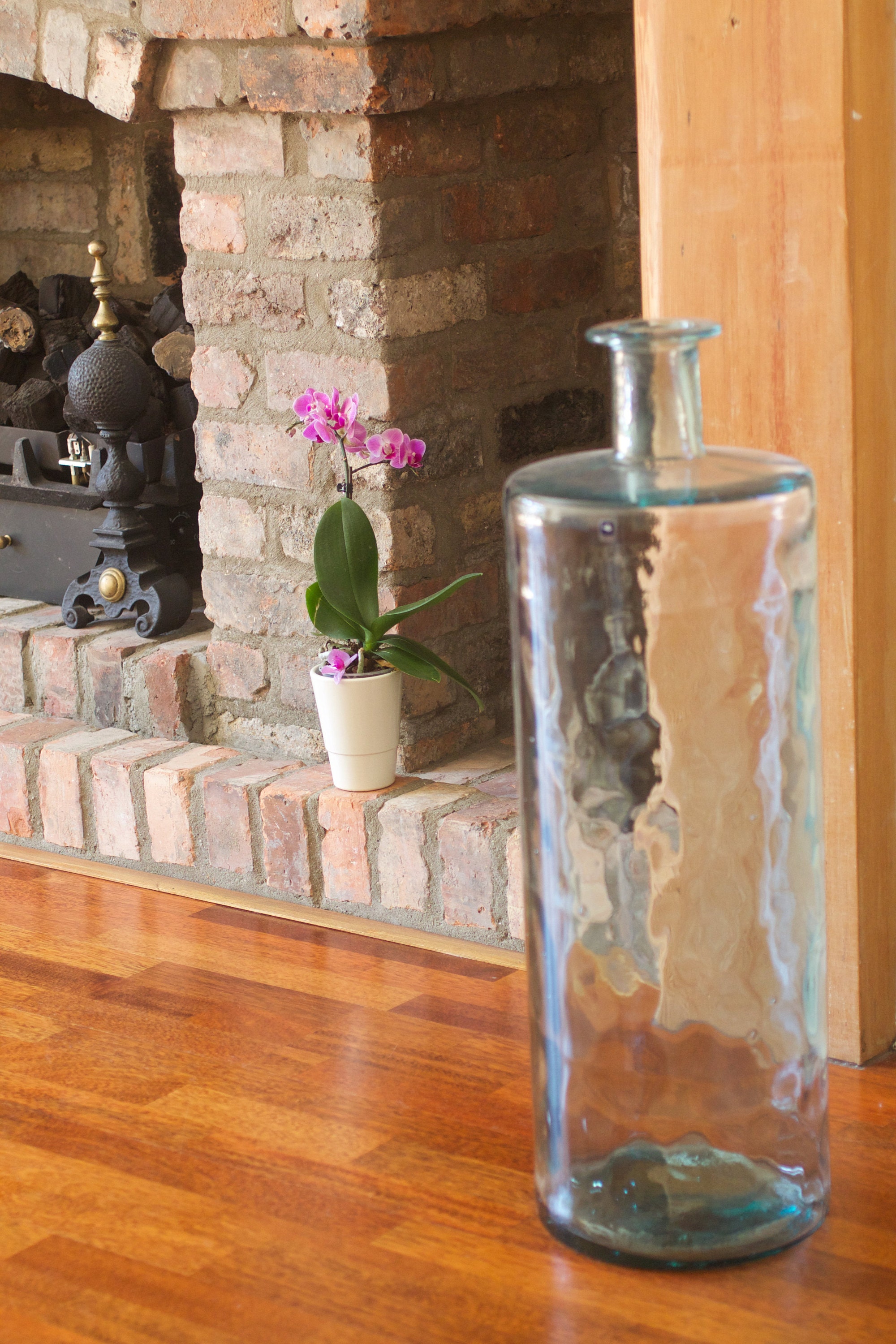 Feng Shui in my former home: Fire element (Hearth) balanced by Earths element (stone), Wood-element (wooden floor) and Water-element (bluish-green glass vase).