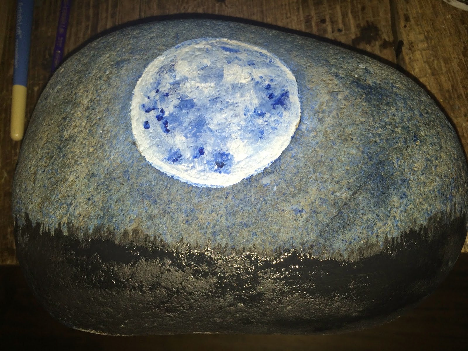 Black shadow land painted at the base of the stone