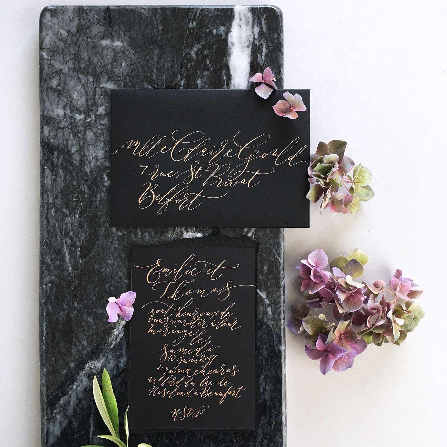 exquisite modern calligraphy lettering with a marble backdrop By Moon and Tide