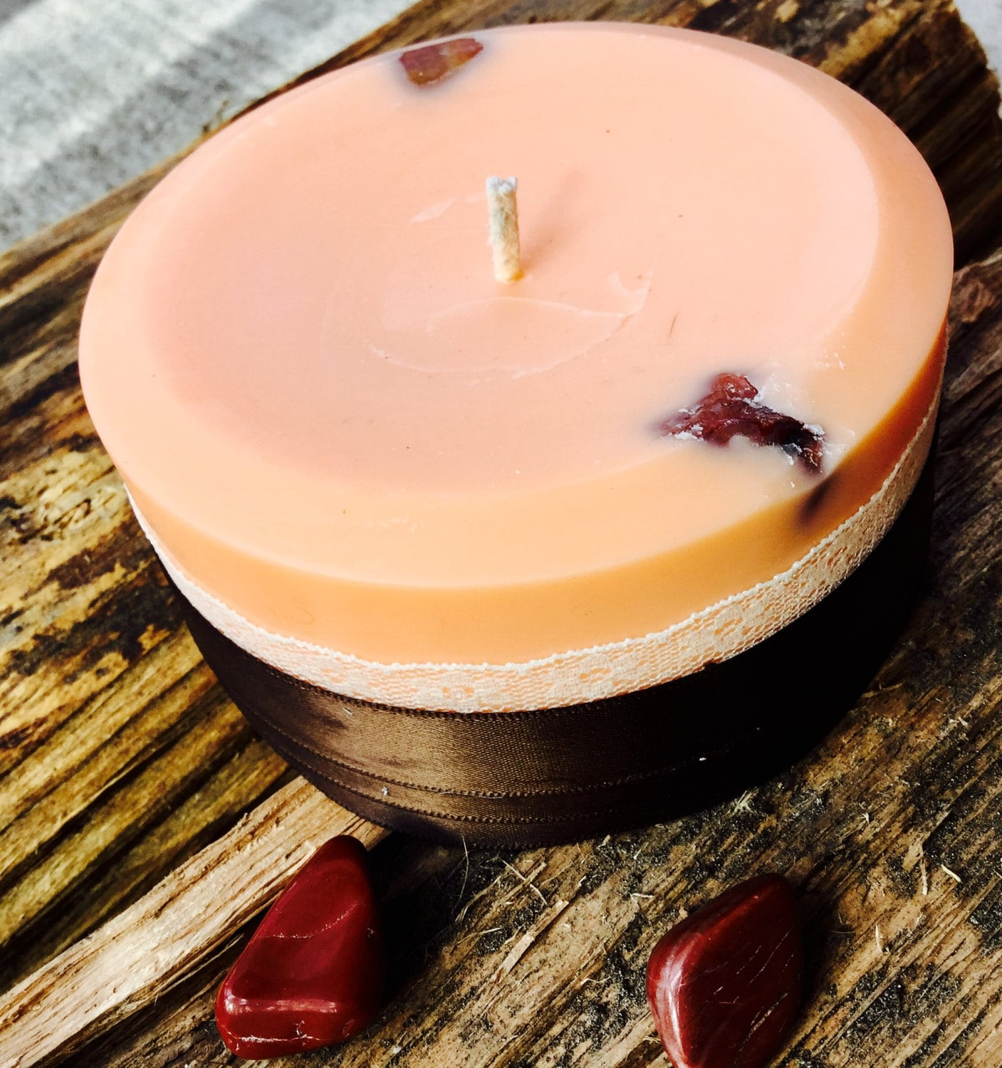 Sandalwood scented soy fertility candle embedded with Red Aventurine and wrapped with lace and ribbon.