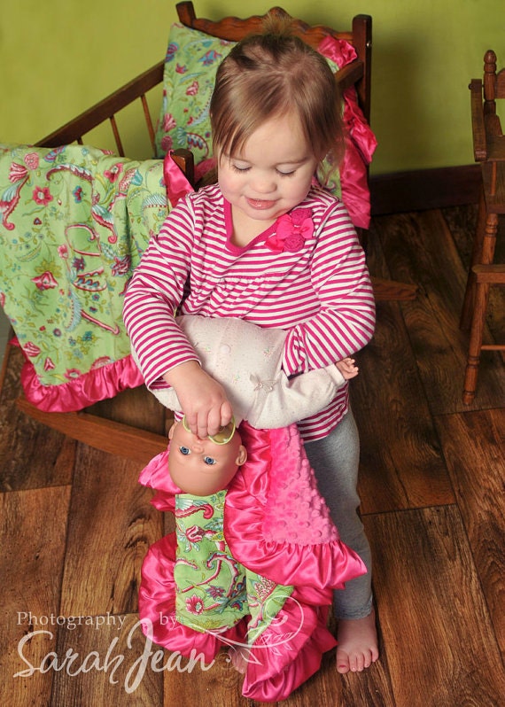 Little girl holding a dolly with her luvy