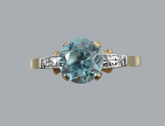 Signed Untermeyer Robbins antique Art Deco 14k gold and platinum natural blue zircon solitaire ring. Circa 1920-40.