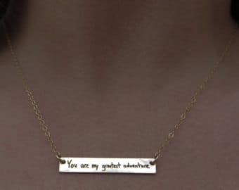 We wish we had a picture of her actual necklace, but this is the listing she choose from.