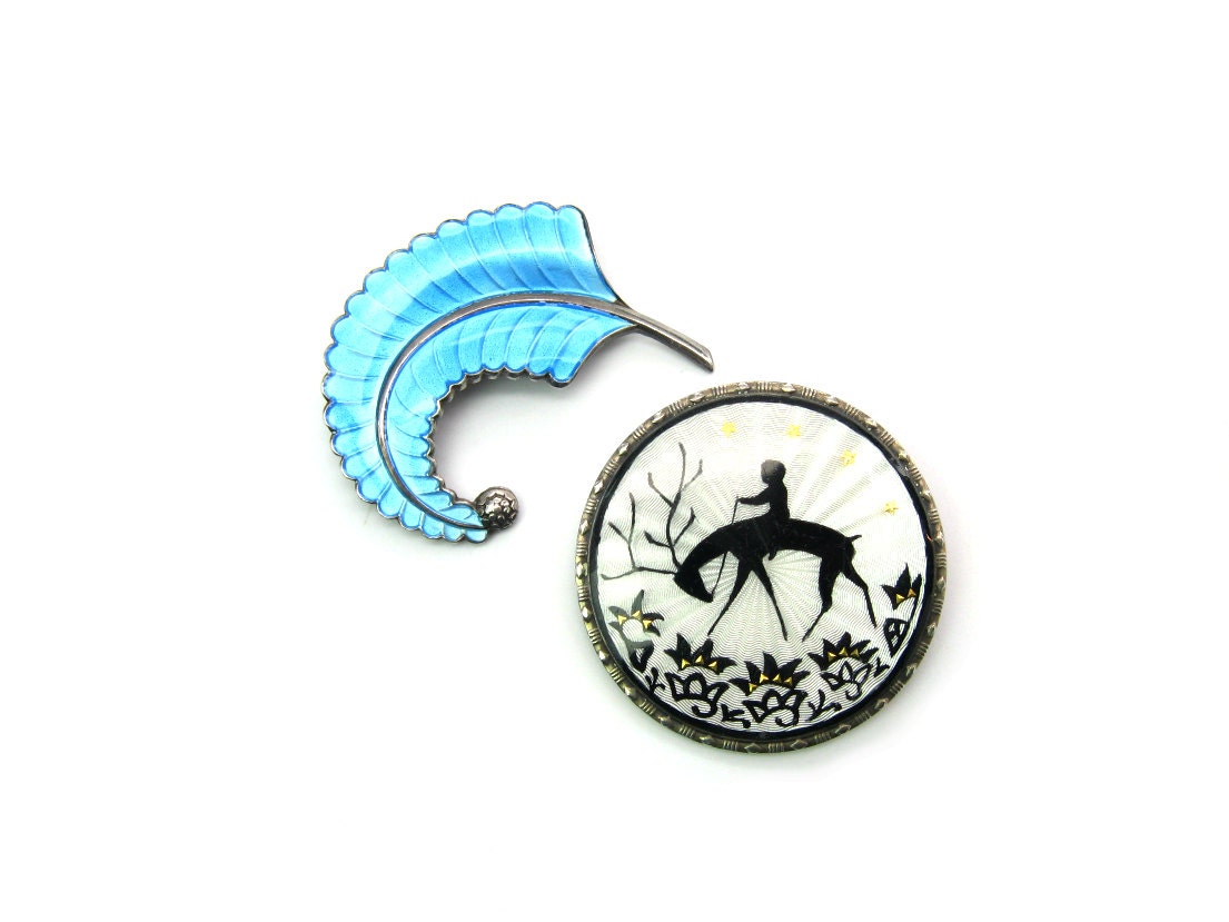 Antique Norway Enamels, champleve feather brooch and guilloche reindeer with child