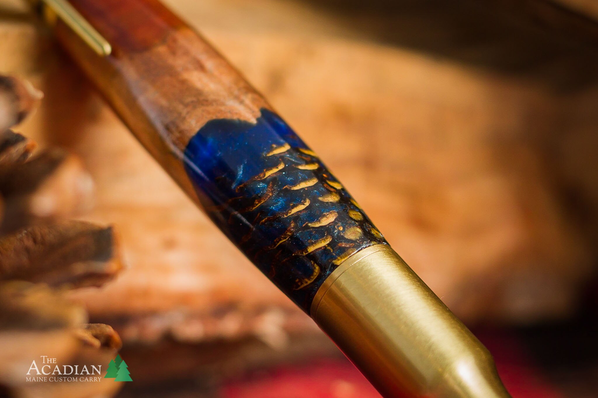 A worthless wood hybrid pen made with acrylic, wood, and a pine cone! Handturned custom pen by The Acadian.