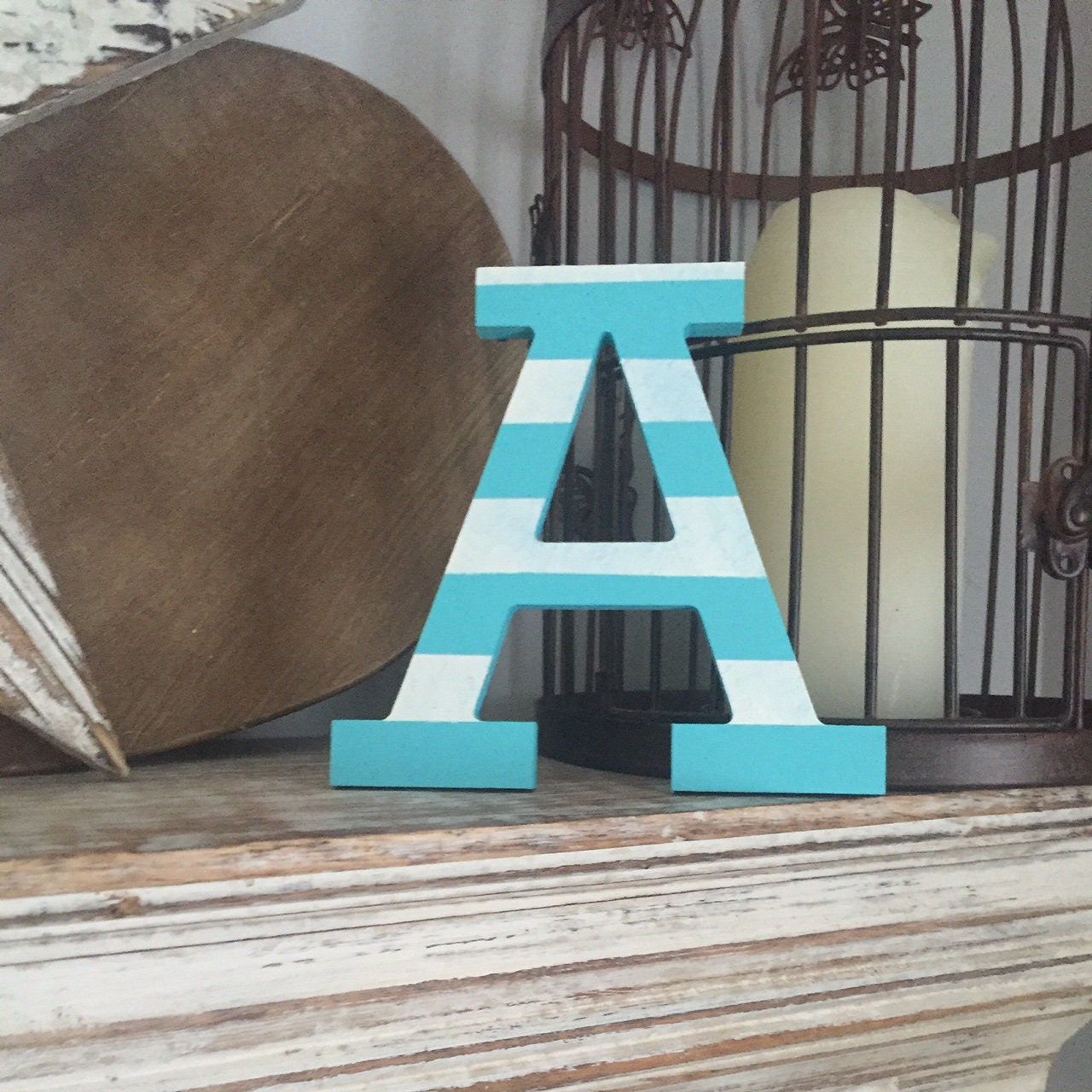 A, Rockwell font, striped finish