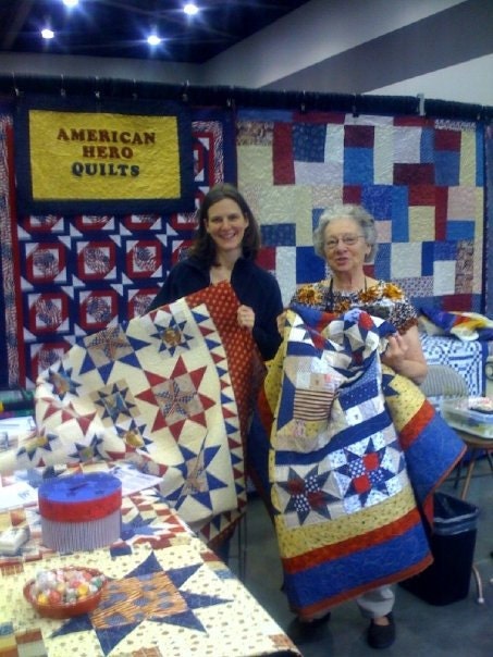 The quilt Im holding...I quilted it! Came across it while wandering through the show.