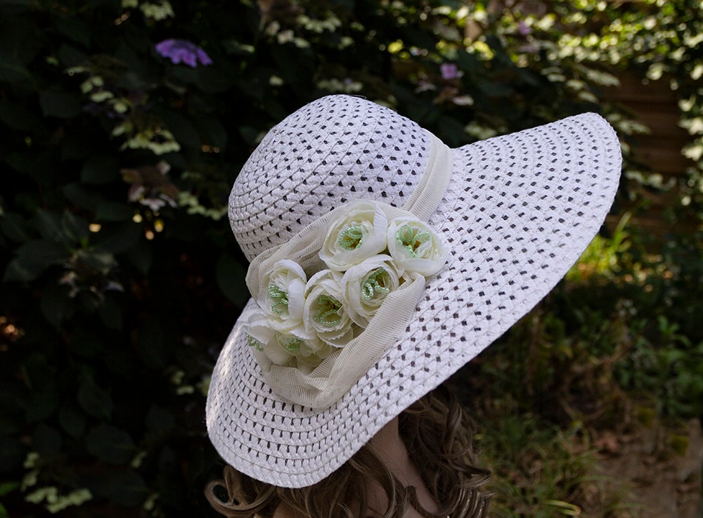 Why we are so fascinated about hats? This small accessory is often more than just a fashionable addition to your outfit. In addition to providing some welcome flair for a stylish ensemble, it can be an indicator of status or position, a necessary item for survival in cold winters or hot deserts. It cna be also used as a basket to store and carry personal items. But for me it is very important prop in the photo shoot. This hat I created from the very cheap summer hat I found in our local 1 $ store. You only need some artificial flowers, fabric, beads, wire, hot glue pistol, pliers and patience. But in a few hours, you will have your own hat and nobody else will have the same hat.