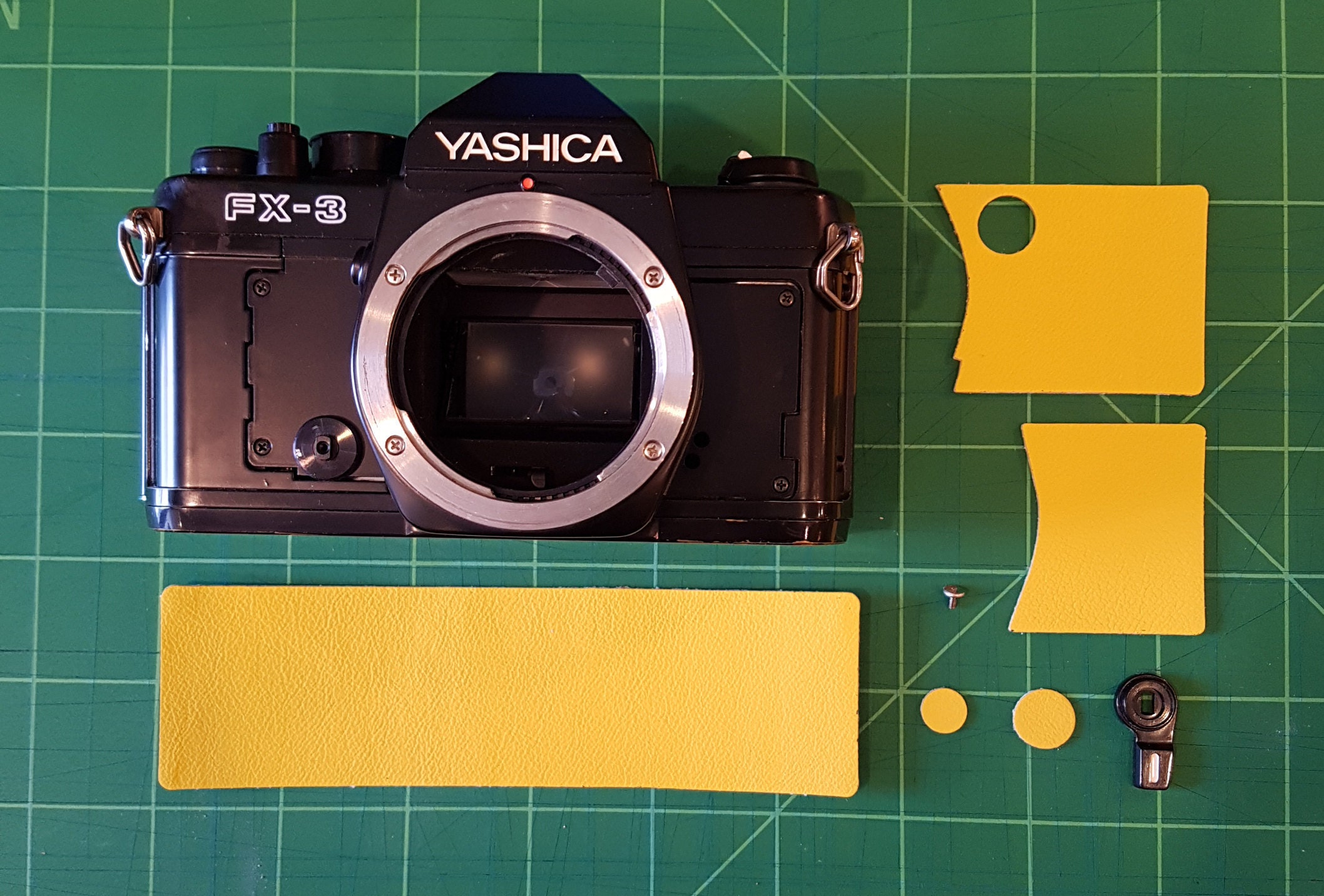 All the pieces laid out, ready to recover this awesome Yashica SLR