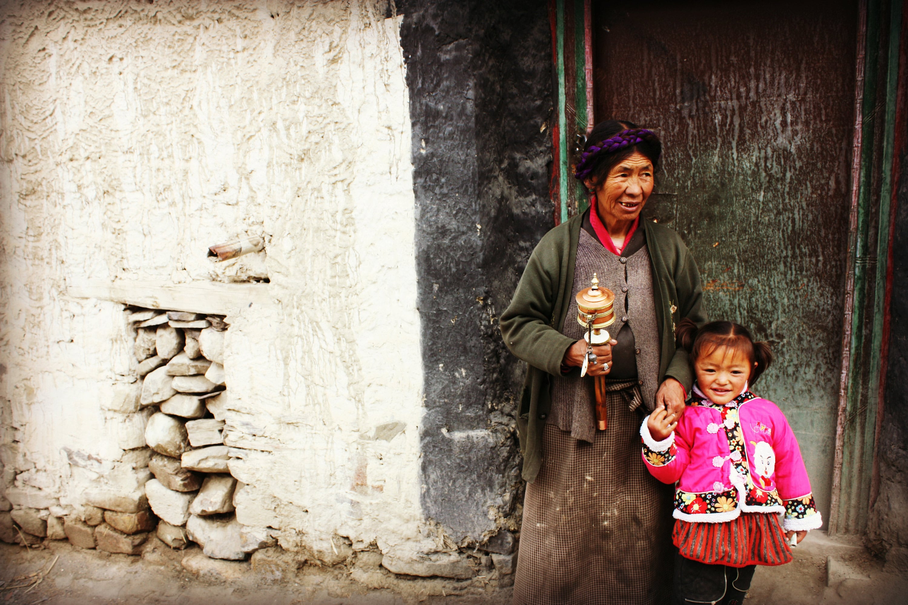 A young Tibetan girl with her Grandmother