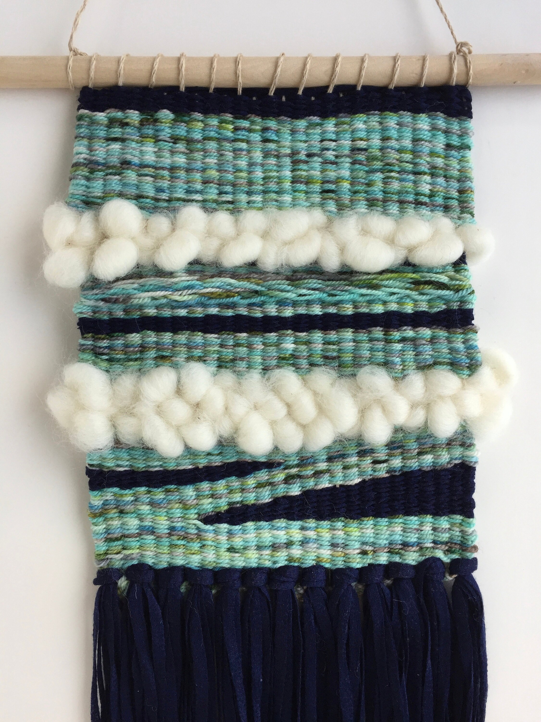 Woven Wall Hanging, with wool roving, merino wool and tencel yarn.