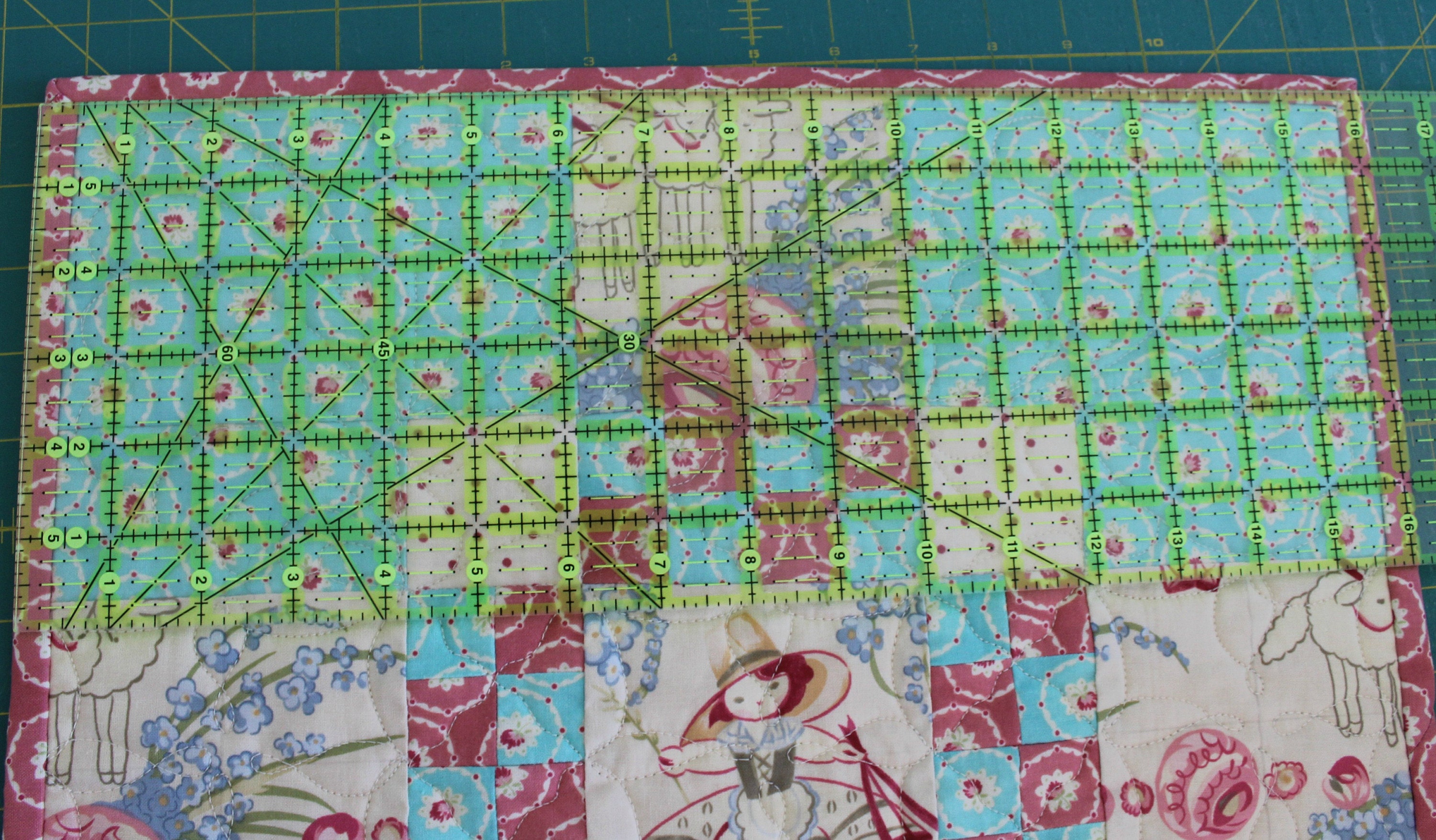 Take a moment to measure the mini-quilt so you can figure out how many hooks to use and where to hang them.