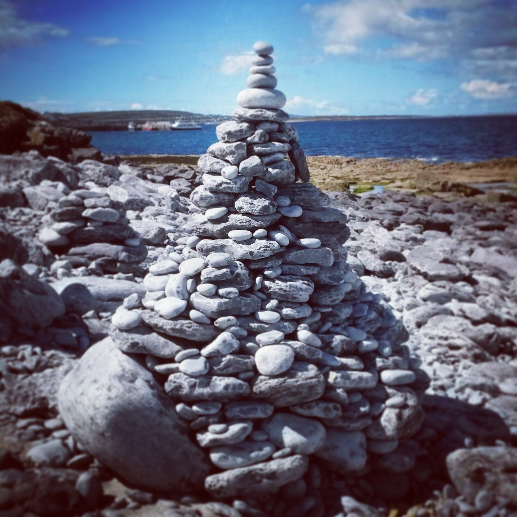 Stone cairn by the shore