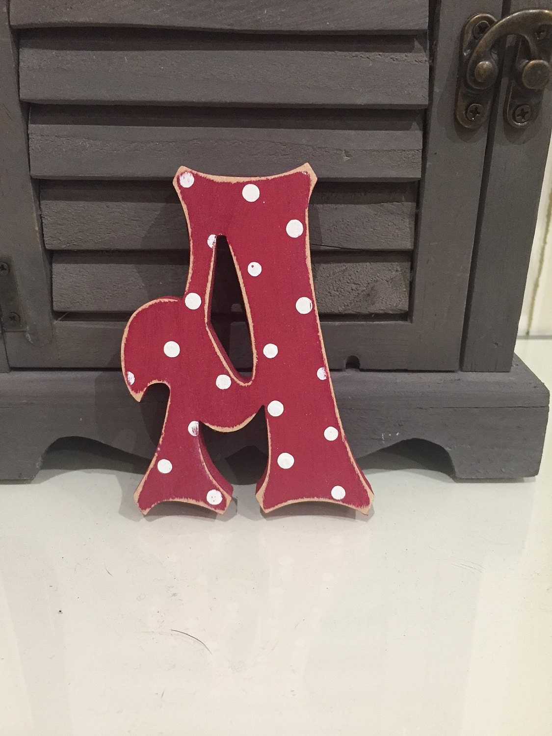 Letter A - Storybook Font - shown in red with white polka dots and a distressed finish