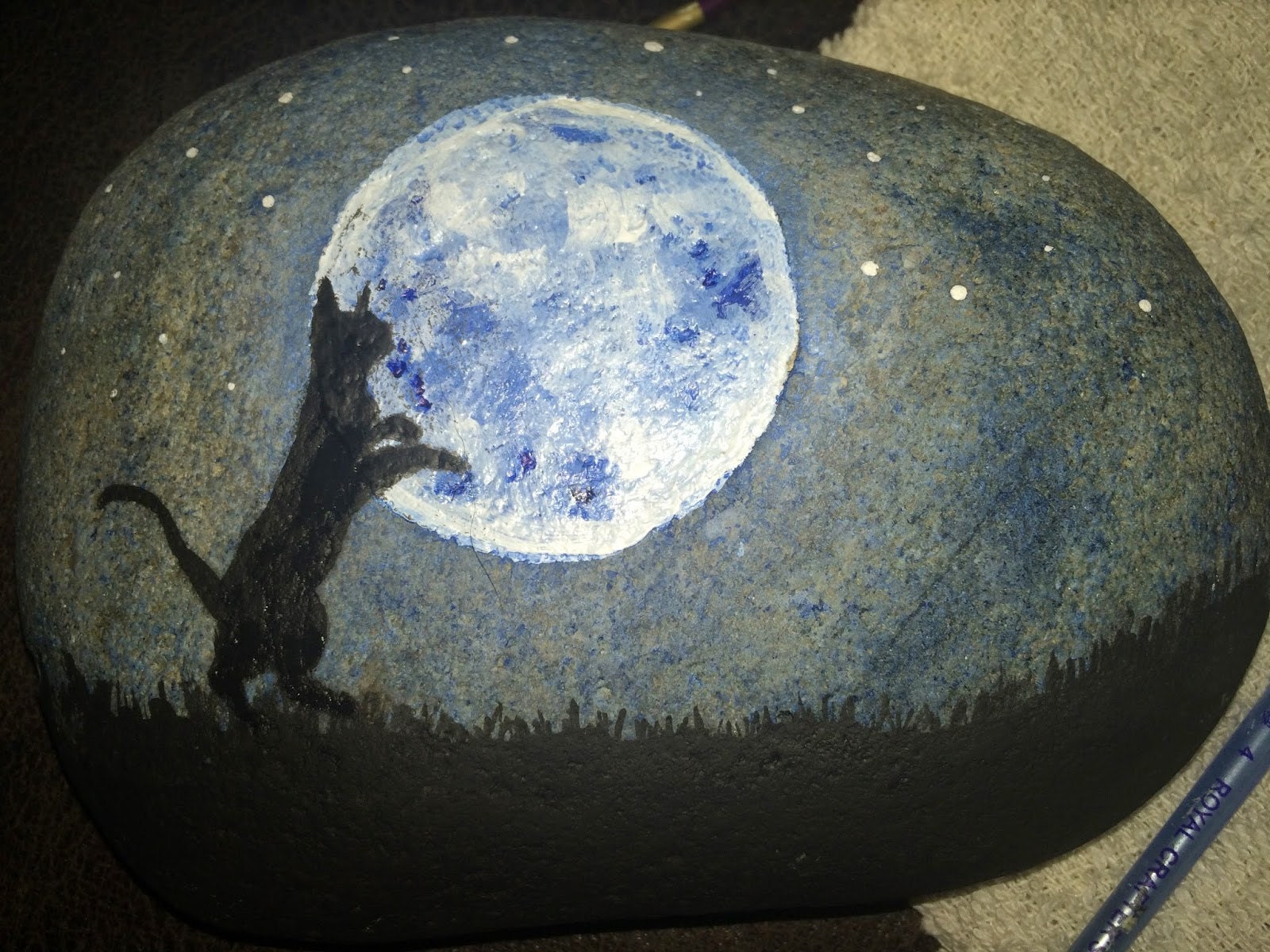 First black cat silhouette painted on the stone